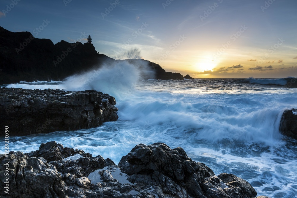 Fototapeta premium Surf, rocky coast with foaming waves at sunset, Faro de Teno, Buenovista, Tenerife, Canary Islands, Spain, Europe