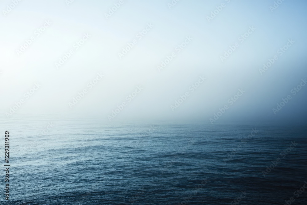 Fototapeta premium Serene Ocean Mist Enveloping Calm Waters