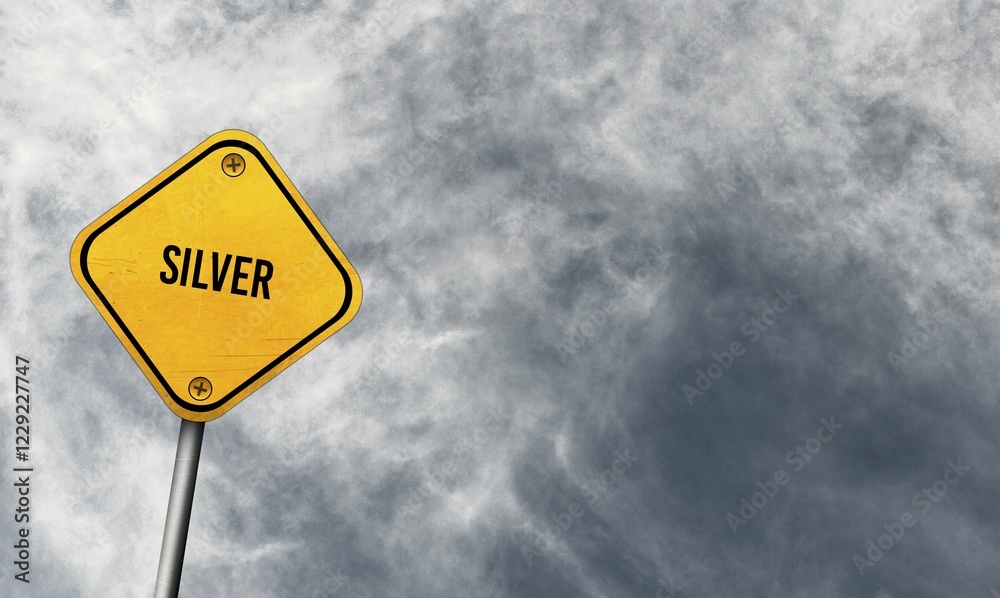 Silver, yellow sign with cloudy sky Silver, yellow sign with cloudy sky