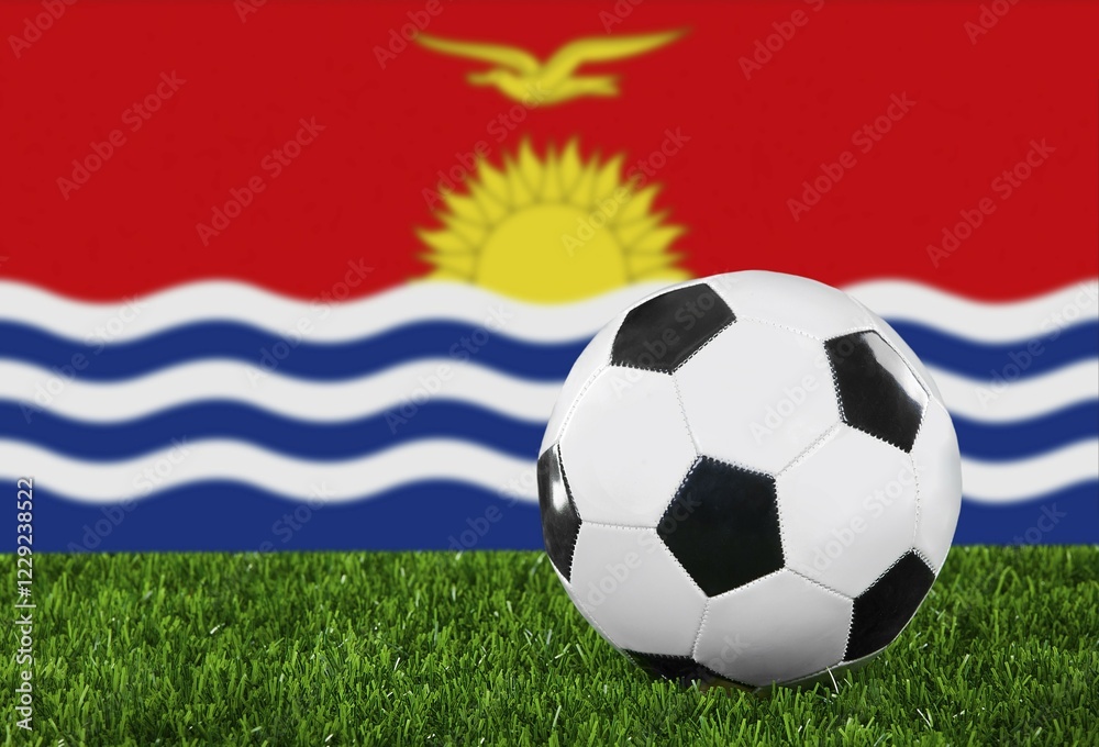 Naklejka premium The Kiribati flag and soccer ball on the green grass