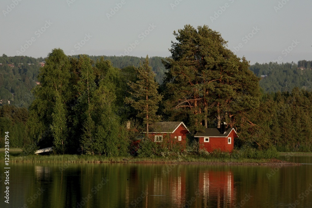 Obraz premium Red houses on a lake island, Sweden, Europe