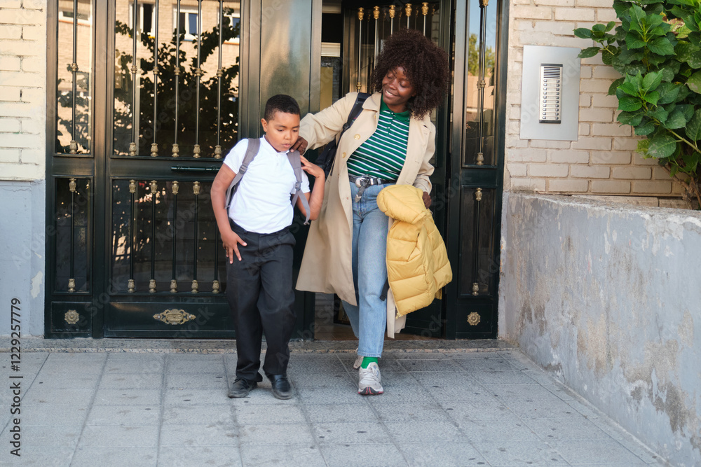 Mother and son walking to school together
