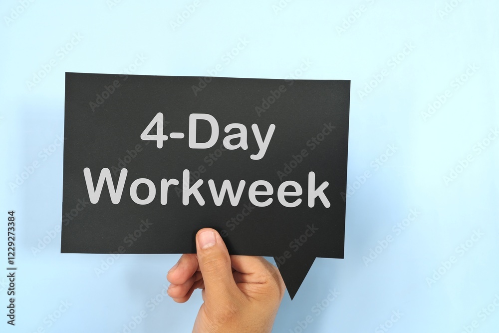 Human hand holding black speech bubble with written 4-day work week.
