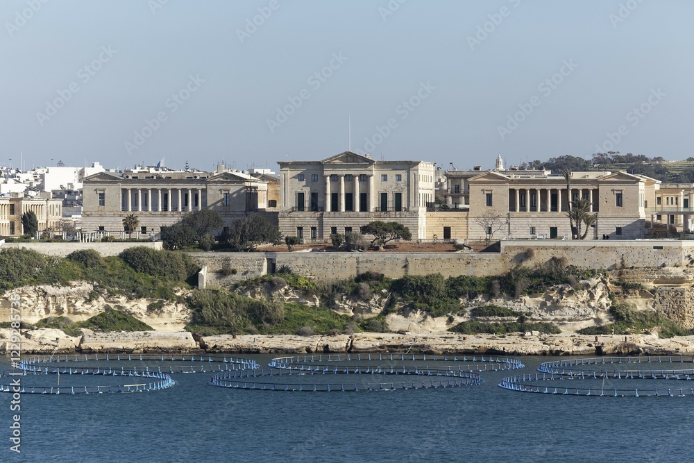 Villa Bighi, today Center for Science and Innovation, at front fish farming in the sea, Kalkara, The Three Cities, Malta, Europe Villa Bighi, today Center for Science and Innovation, at front fish farming in the sea, Kalkara, The Three Cities, Malta, Europe