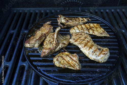 Grilled turkey meat, turkey steaks on the grill, Bavaria, Germany, Europe photo