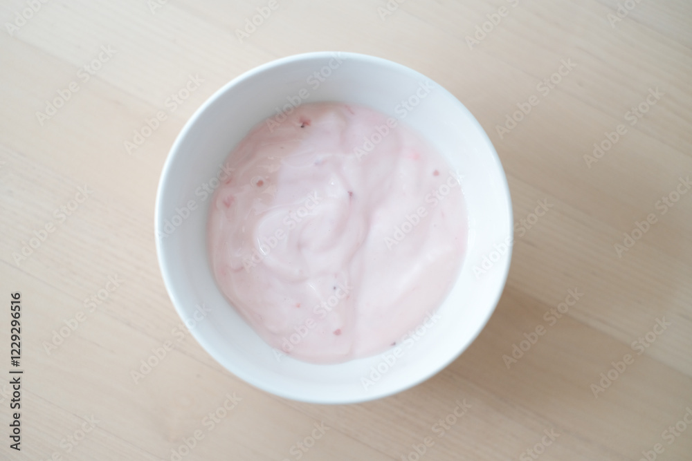Homemade strawberry yogurt in white bowl. Homemade strawberry yogurt in white bowl.