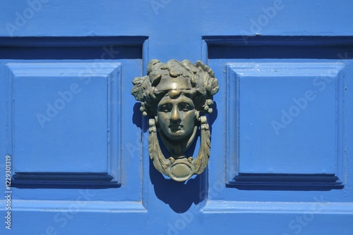 Head shaped door knocker on a blue door, Mykonos Town or Chora, Mykonos, Cyclades, Greece, Europe