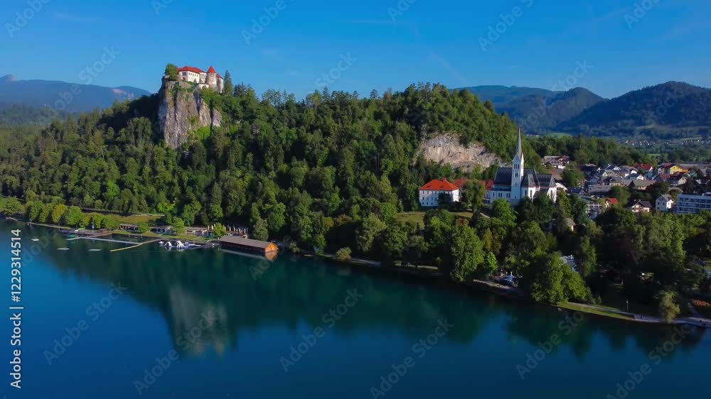 Aerial 4K drone video of Bled Town and Bled Castle on a clear sunny summer's morning - Lake Bled, Slovenia Aerial 4K drone video of Bled Town and Bled Castle on a clear sunny summer's morning - Lake Bled, Slovenia