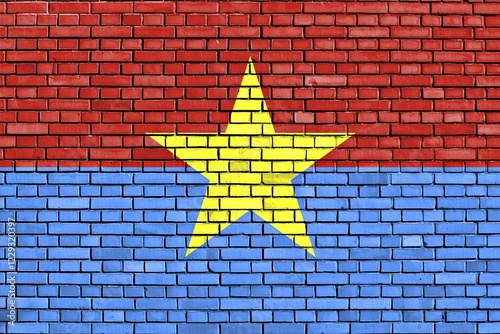 Flag of Viet Cong painted on brick wall photo