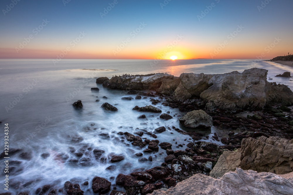 Sunset over the rugged cliffs of Malibu coast Sunset over the rugged cliffs of Malibu coast