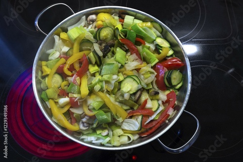 Vegetable pan on a red-hot cooktop