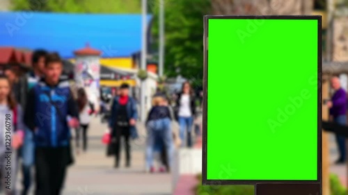 Green Screen Billboard in the market During the day when it is crowded with visitors shopping for food