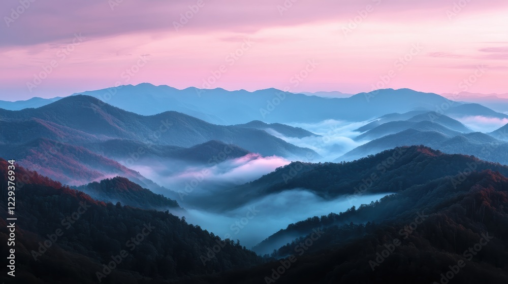 Obraz premium A peaceful sunrise hike with a panoramic view of the mountains.