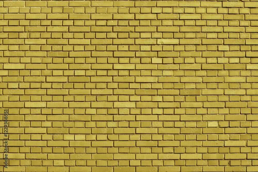 Fototapeta premium Ceylon Yellow colored brick wall background