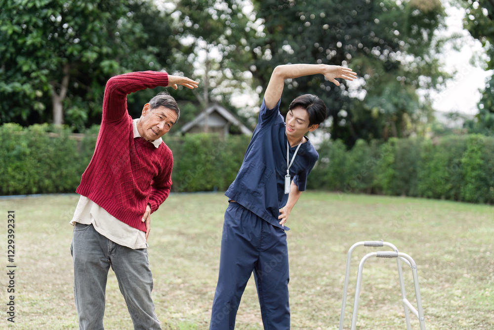 Obraz premium Health caregiver assisting elderly man with stretching exercises outdoors for rehabilitation therapy