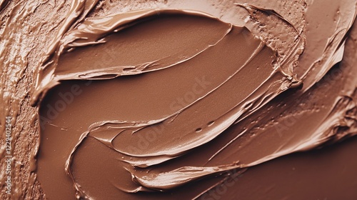 Smeared chocolate cream texture background.