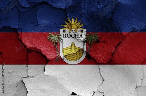 Flag of Rocha Department painted on cracked wall photo