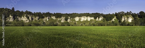 Rock formation twelve apostles with a green meadow, Altmuehltal nature park, near Solhofen, Bavaria, Germany, Europe photo