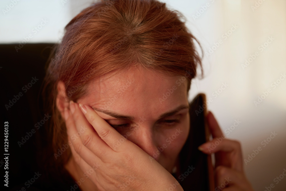 Portrait of businesswoman talking on the phone and having a worried expression. Portrait of businesswoman talking on the phone and having a worried expression.