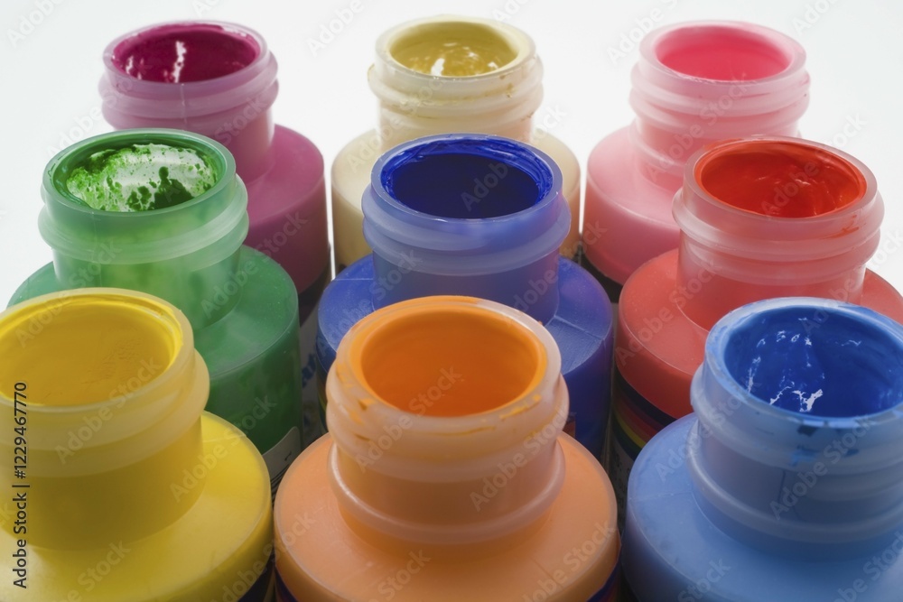 Plastic paint bottles with caps removed Plastic paint bottles with caps removed
