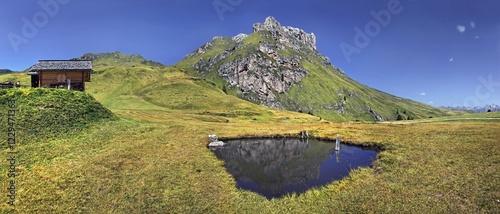 Small lake or pond at Mt Peitlerkofel, Sasso delle Putia, with mountain hut, Villnoess, Funes, Dolomites, South Tyrol, Italy, Europe photo