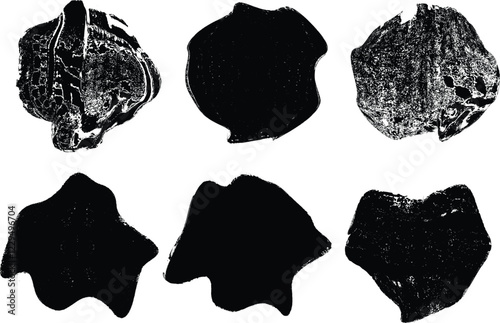 Sprayed black shapes composition .Graffiti art design . Noise textured shapes . Spray effect .Grunge texture .Art design forms.Distressed element .Rough roller paint shapes .Vector
