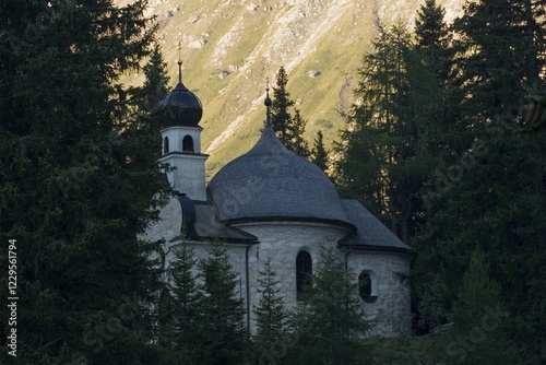 Chapel at Obernberg lake in Stubaier Alpen Tyrol Austria photo