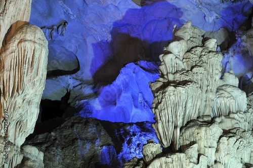 Quadro su tela Colourfully, illuminated rock formation in Hang Sung Sot cave, Surprise Cave, Ca