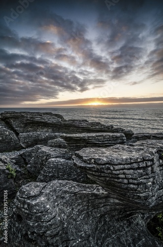 Sunset at Pancake Rocks, Paparoa National Park, Punakaiki, South Island, New Zealand, Oceania photo