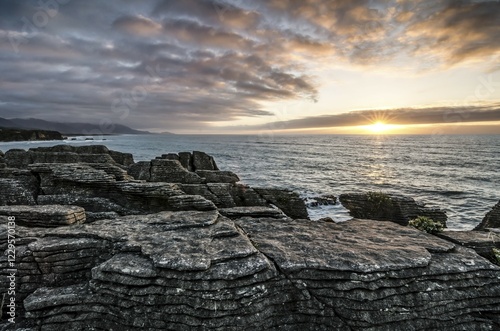 Sunset at Pancake Rocks, Paparoa National Park, Punakaiki, South Island, New Zealand, Oceania photo