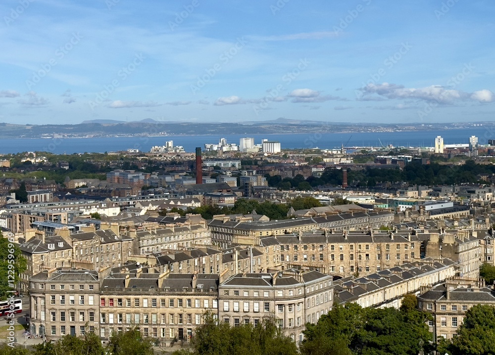 A high angle view view from Calton Hill looking towards the Firth of Forth across the city of Edinburgh, Scotland, UK. A high angle view view from Calton Hill looking towards the Firth of Forth across the city of Edinburgh, Scotland, UK.