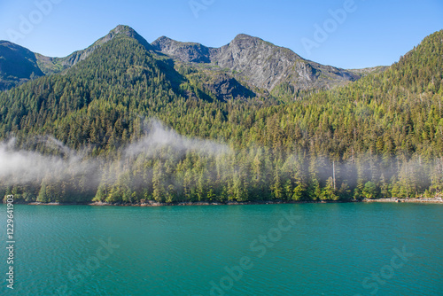 Landscape of island with pine and cedar trees forest along Inside Passage cruise between Prince Rupert and Port Hardy, Vancouver Island, British Columbia, Canada. photo