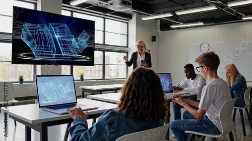 Students engage in technology-focused learning with holograms in a modern classroom