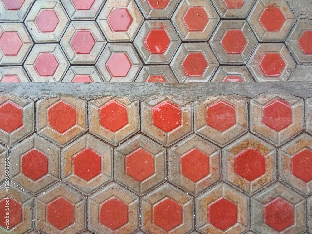 Hexagonal red and grey floor tiles with a wet and shiny surface. Seamless pattern. Hexagonal red and grey floor tiles with a wet and shiny surface. Seamless pattern.