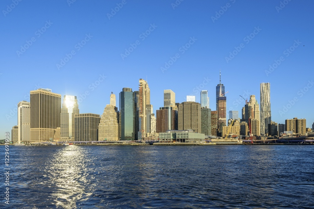 View from Pier 1 over the East River to the skyline of Manhattan, Dumbo, Downtown Brooklyn, Brooklyn, New York View from Pier 1 over the East River to the skyline of Manhattan, Dumbo, Downtown Brooklyn, Brooklyn, New York
