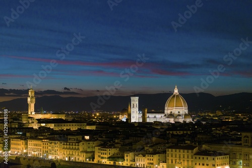 Panoramic view of illuminated city at dusk from Michelangelo Square, Piazzale Michelangelo, with Cathedral of Santa Maria del Fiore and Palazzo Vecchio, Florence, Tuscany, Italy, Europe