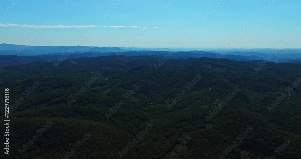Mountain Paths Layers Of Green Forests Wind Turbines Spinning In The Far Distance Aerial High Altitude Steady Shot Mountain Paths Layers Of Green Forests Wind Turbines Spinning In The Far Distance Aerial High Altitude Steady Shot