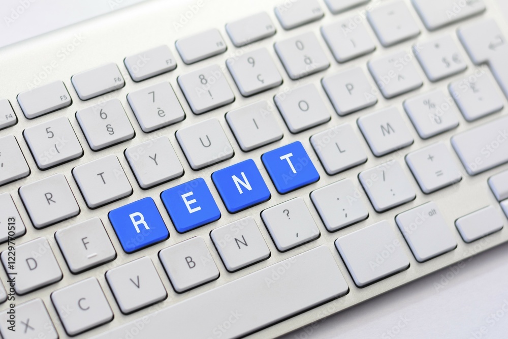 RENT writing on white keyboard RENT writing on white keyboard
