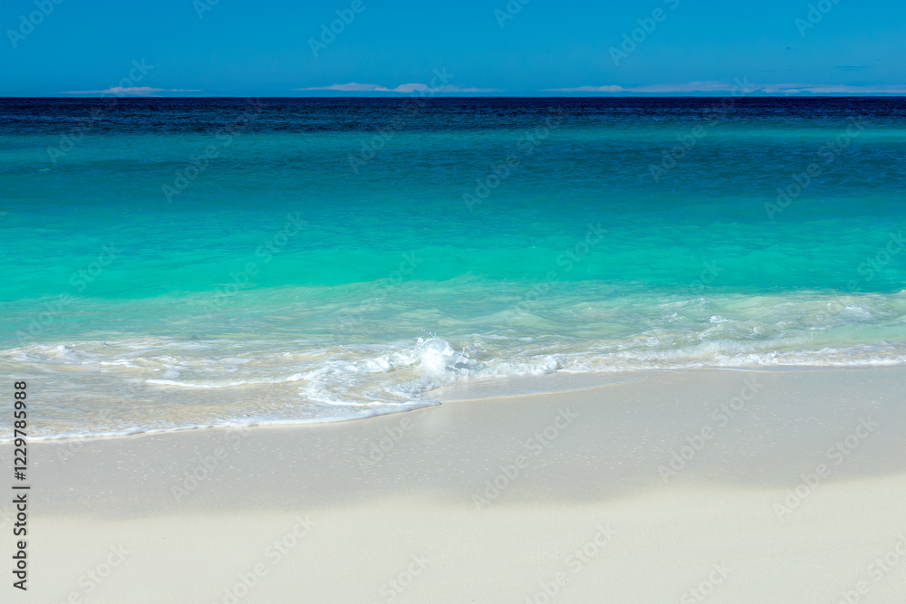 Front view of blue transparent water and perfect white sand in Shoal Bay beach, Caribbean dream background in Anguilla island, British West Indies