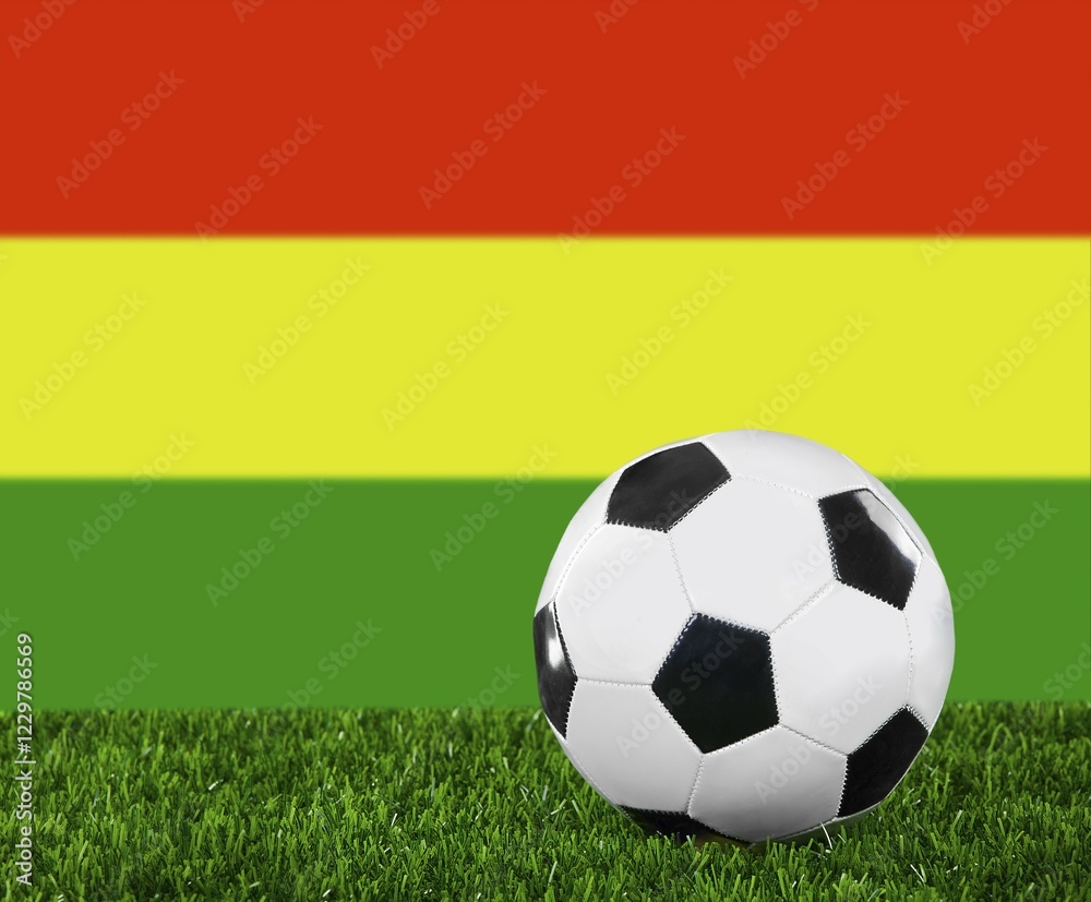 The Bolivian flag and soccer ball on the green grass The Bolivian flag and soccer ball on the green grass