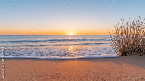 Mental health recovery and growth, A serene beach scene at sunset with gentle waves lapping at the shore and tall grass swaying in the warm evening light.
