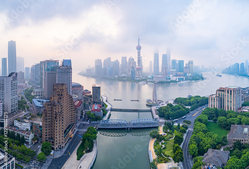 Aerial view of shanghai skyline with misty fog at sunrise