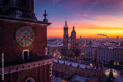 Panorama of Main Square (Saint Mary's Basilica, Sukiennice - Town Hall, Town Hall Tower) in Krakow during magic dawn in winter, Poland