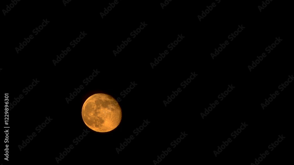 Orange moon floats across the sky. Timelapse. Close-up. Orange moon floats across the sky. Timelapse. Close-up.
