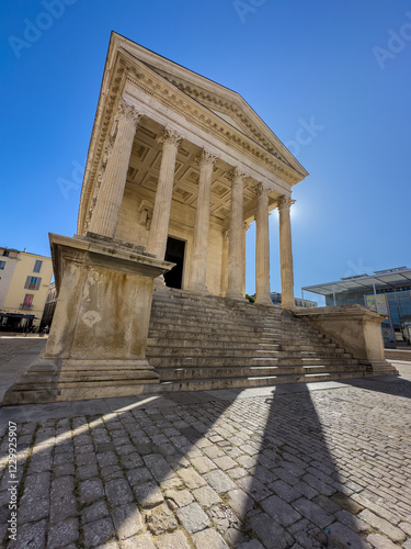 Maison Carree - restored roman temple dedicated to 'princes of youth', with richly decorated columns & friezes in Nimes, France