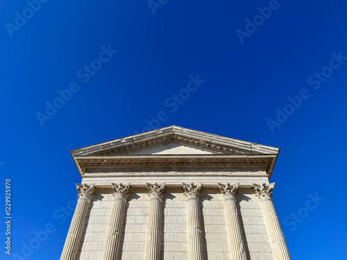 Maison Carree - restored roman temple dedicated to 'princes of youth', with richly decorated columns & friezes in Nimes, France