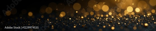 Luxury gold flakes on black background with bokeh effect, glittery, bokeh
