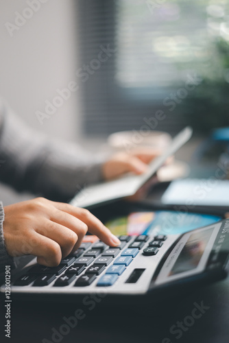 Wallpaper Mural Finance bank tax expense accounting budget money businessman hand use calculator Financial calculate accountant close up calculator with graph chart write office desk Business expense analysis saving Torontodigital.ca