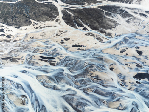 Abstract patterns in a river from a glacier.
