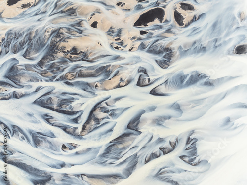 Abstract patterns in a river from a glacier.
